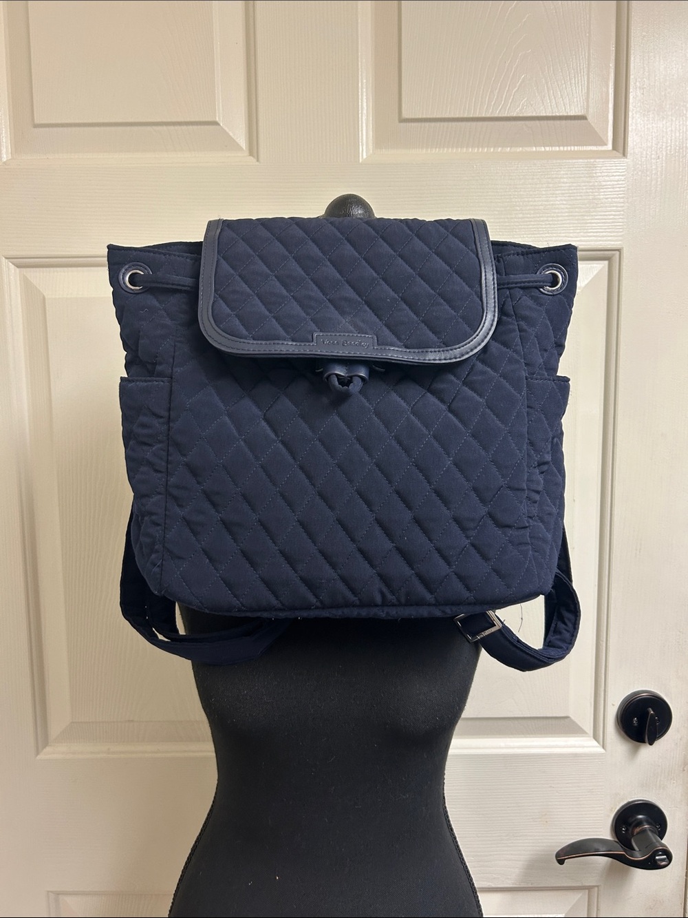 Vera Bradley quilted backpack in navy blue, diamond pattern a front flap closure